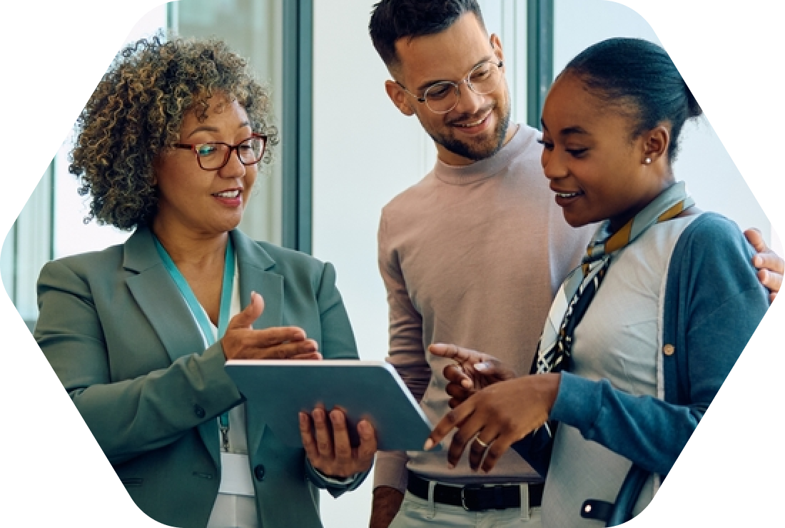 One Focus: Propelling Independent Community Banks Forward, two women and one man with one of the women possibly showing something on an electronic device